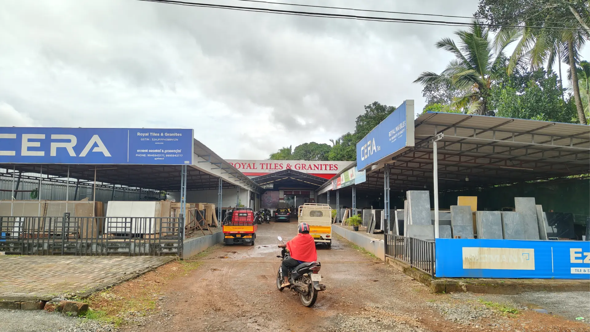 Showroom Exterior With Motorcycle - Royal Tiles & Granites Showroom Gallery